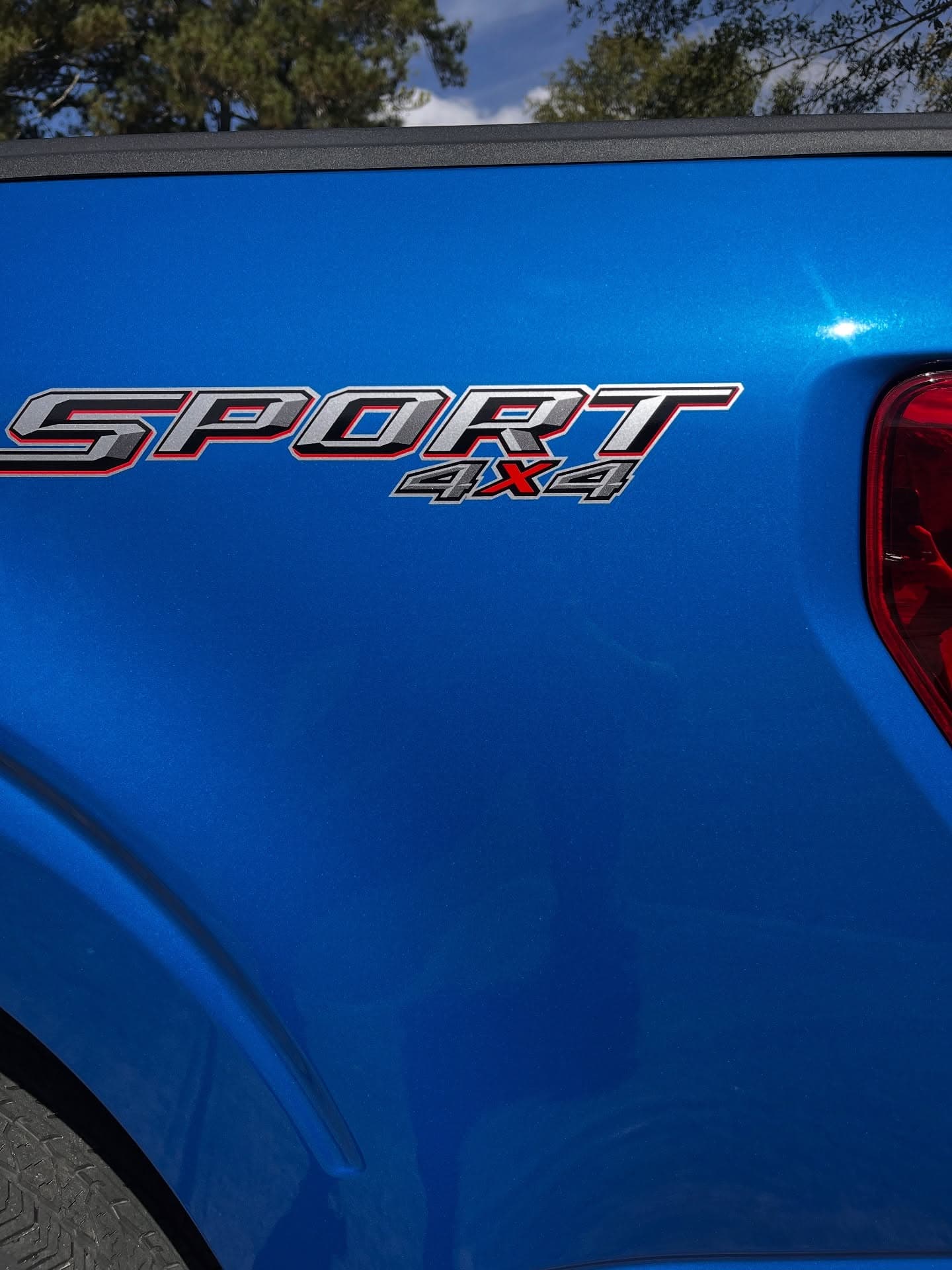 After paint correction, glossy scratch-free blue truck fender, Cumming GA